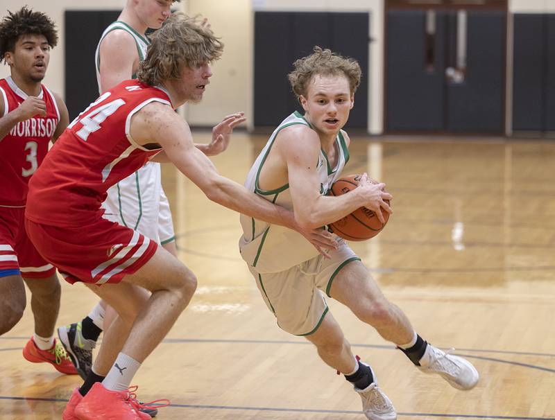 Rock Falls’ Gavin Sands handles the ball on the way to the hoop against Morrison Wednesday, Feb. 21, 2024 at the Prophestown class 2A basketball regional.