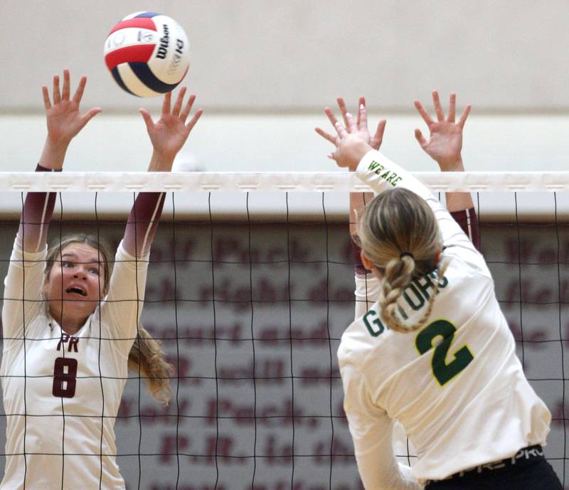 Prairie Ridge’s Brynn Palmer, left, blocks Crystal Lake South’s Kendall Brandt in varsity girls volleyball on Thursday, Aug. 29, 2024, at Prairie Ridge High School in Crystal Lake.