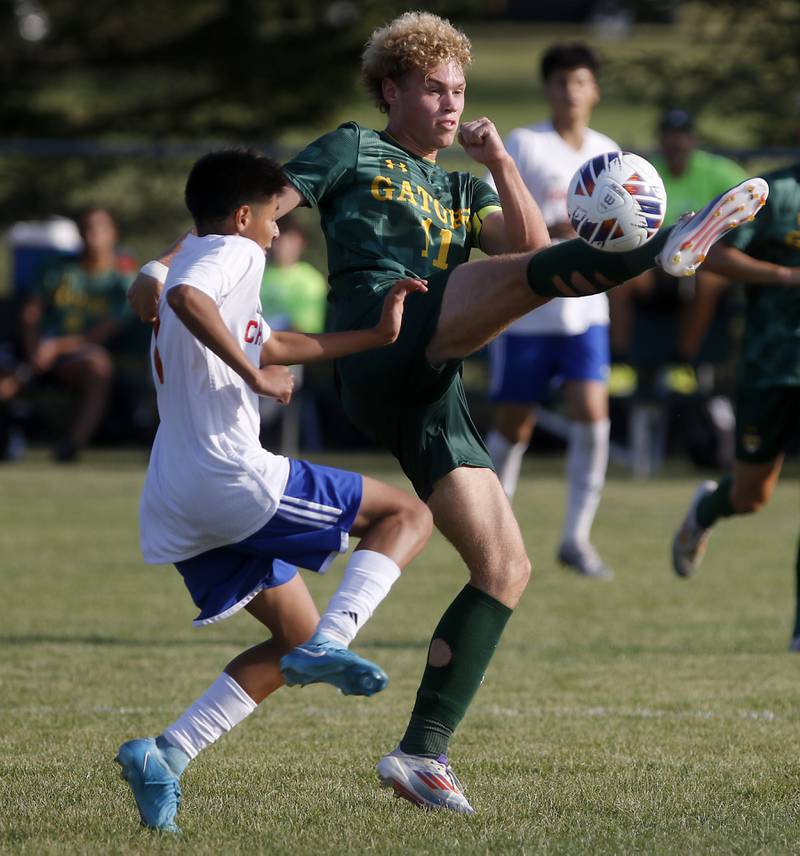 Crystal Lake South's Mason Ross kicks the ball away from Dundee-Crown's Ayden Hernandez during a Fox Valley Conference soccer match on Tuesday, Sept. 10, 2024, at Crystal Lake South High School.