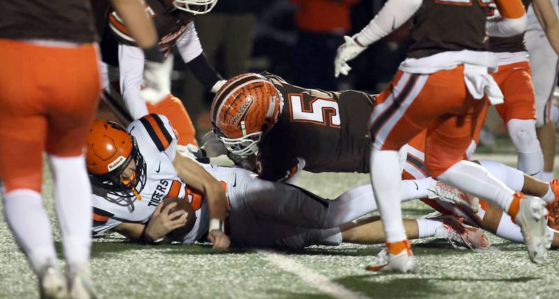 Wheaton Warrenville South's Luca Carbonaro (15) slips into the end zone against Hersey during the IHSA Class 7A playoffs Saturday October 28, 2023 in Arlington Heights.