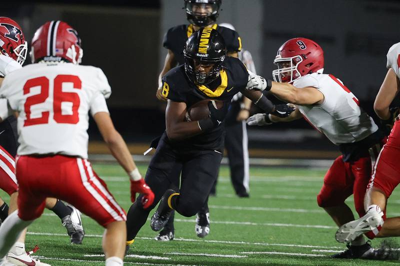 Joliet West’s Taivaughn Johnson finds a hole on a run against Yorkville on Friday, Sept. 13, 2024 in Joliet.