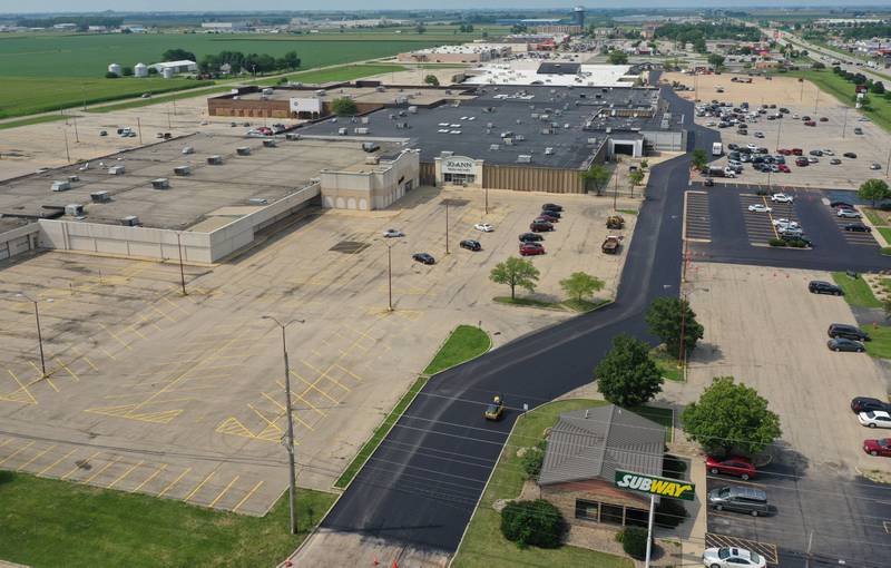 An aerial view of the Peru Mall as crews paved the entrance road on Monday, July 17, 2023 in Peru.