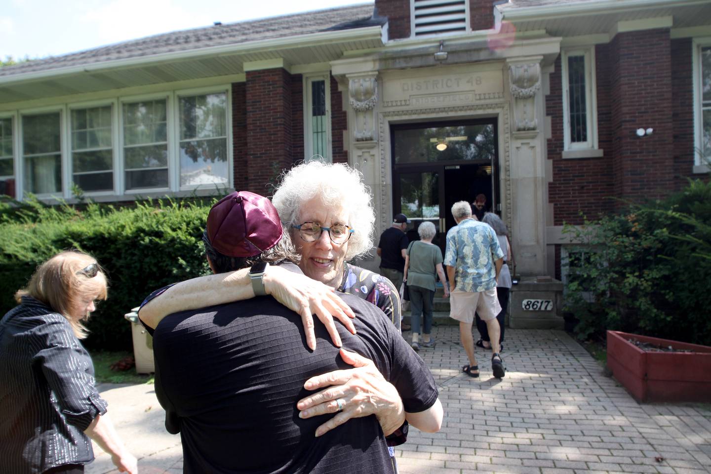 Rabbi Maralee Gordon greets people as the McHenry County Jewish Congregation held a deconsecration ceremony at their Ridgefield Road location in preparation for a move to the Tree of Life Unitarian Church in McHenry on Sunday, August 18.