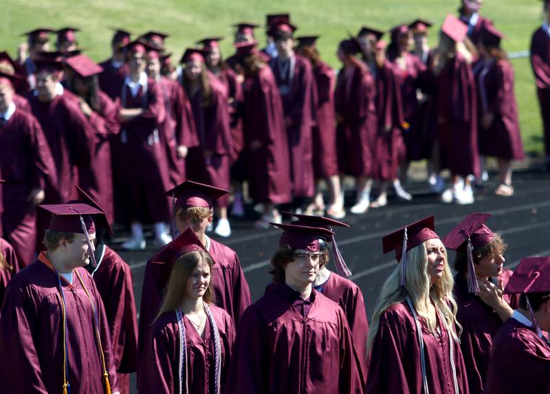 Members of the Prairie Ridge High School Class of 2024 march to commencement at the school in Crystal Lake on Saturday.