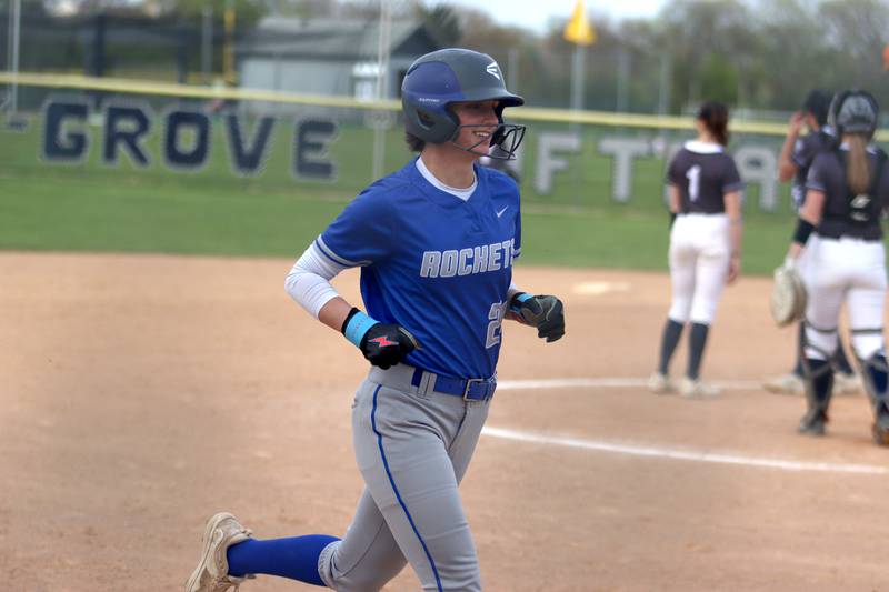 Burlington Central’s Kendall Glonek arrives home on a home run in varsity softball at Cary Monday.