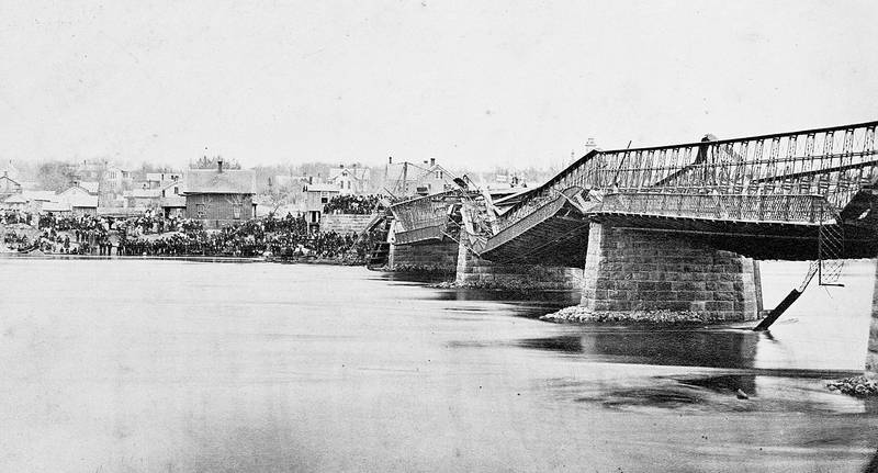 A public domain photo shows the Truesdale bridge after its collapse on May 4, 1873. The deaths of 46 people make it one of the deadliest bridge disasters in United States history.