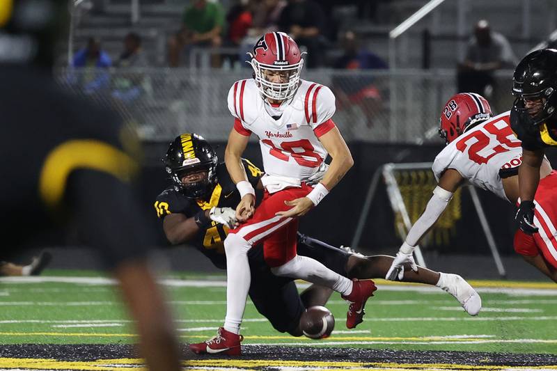 Joliet West’s Mohamed Kosh knocks the ball away from Yorkville’s Jack Beetham on Friday, Sept. 13, 2024 in Joliet.