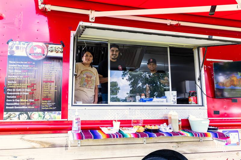 Elizabeth Rivera, Alex Sanchez, and Dylan Creales work the Supermercado Joliet food truck during Lockport Township Park District's Juneteenth Celebration at A.F. Hill Park on June 19, 2024.