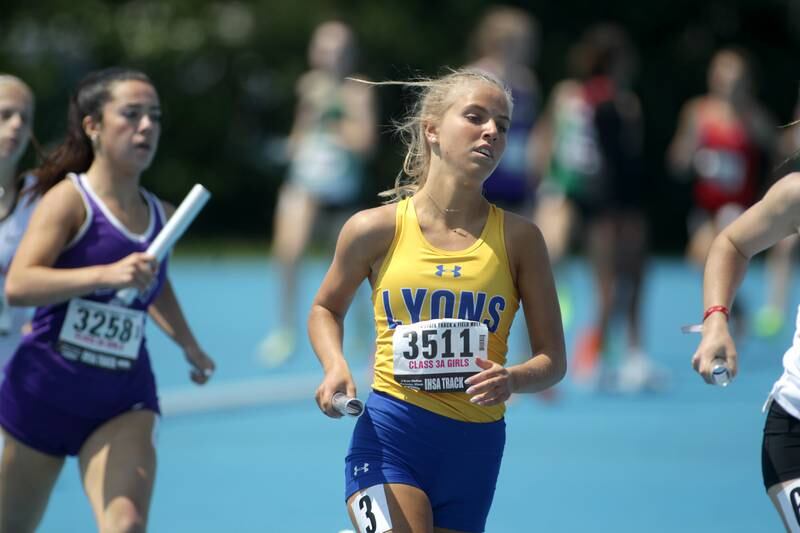 Lyons Township’s Catherine Sommerfeld runs a leg of the 3A 4x800-meter relay during the IHSA State Track and Field Finals at Eastern Illinois University in Charleston on Saturday, May 20, 2023.