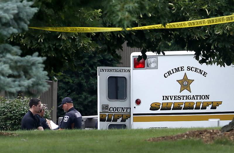 Officers from the McHenry County Sheriff and other departments investigate a shooting in the 5800 block of Wild Plum Road in unincorporated Crystal Lake Wednesday Aug. 9, 2023. The department was called to the scene at around 3:50 a.m. for reports of multiple gunshots fired. according to Tim Creighton, from the sheriff’s department five people were found at the home. Three women were deceased, a women, and man were transported to the hospital where the man later died.