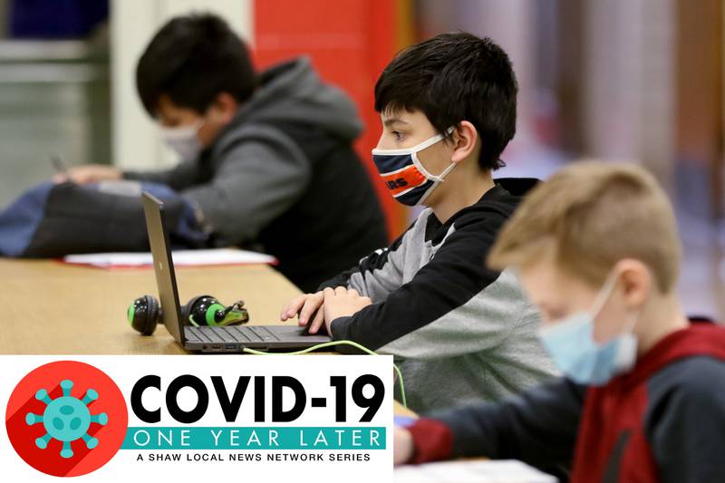 From left: Kenneth Valencia, Karter Hall, and Terrence Criscione work after school in a homework help program at Marengo Community Middle School on Wednesday, March 24, 2021 in Marengo.