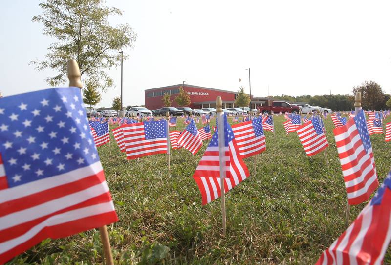 Waltham School placed 2,977 flags outside the school lawn to remember the lives lost in the 9/11 attacks on Monday, Sept. 11, 2023 in Utica.