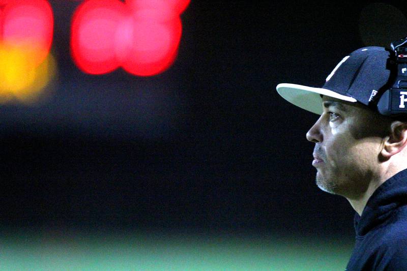 Marengo’s Head Coach Paul Forsythe guides the Indians against Richmond Burton in varsity football at Rod Poppe Field on the campus of Marengo High School in Marengo on Friday, Oct. 18, 2024.