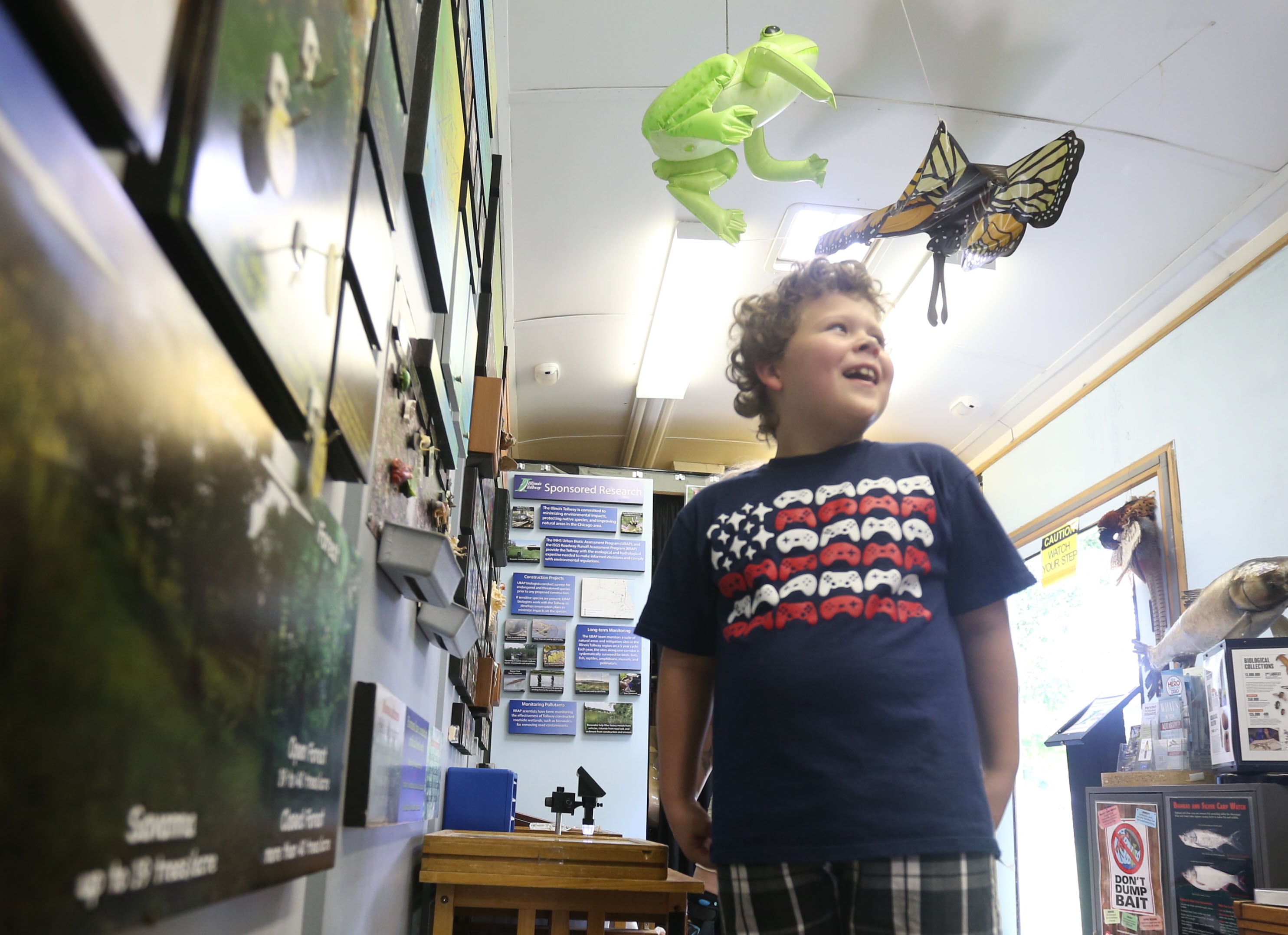 Siegman Lydia of Granville, explores The Illinois Natural History Survey Traveling Science Center on Tuesday, July 30,  2024 at Hopkins Park in Granville.
The Illinois Natural History Survey Traveling Science Center is a 320-square-foot mobile classroom featuring informative, engaging exhibits on biodiversity and natural resources that visits schools and communities across Illinois.
Visitors learn about the types of habitats and species diversity of their region, as well as ways to protect against threats to that diversity.
Since 2006, the center has visited more than 150 communities and 200 public events while providing structured school programs for up to 30,000 students each year. Sponsors are North Central Bank, Granville National Bank, Boggios Orchard & Produce and Financial Plus Credit Union.