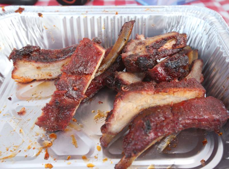 A pan of bbq ribs awaits samplers during the BBQ and Blues festival on Friday, Sept. 13, 2024 downtown La Salle.