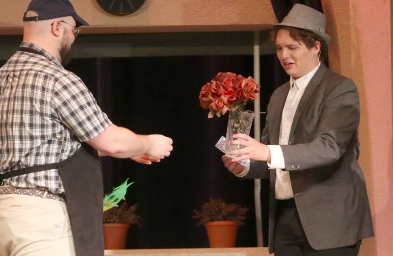 Austin Allbert as Seymour and Trekker Klema as a customer of Mushnik's Skid Row Florists acts out a scene during a rehearsal of  "The Little Shop of Horrors"  in the Mendota Community Theatre on Monday, June 17, 2024 at Mendota High School.