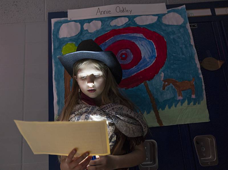 Ariana Handel talks about Annie Oakley on Thursday, May 16, 2024, at Washington School in Sterling. The third-grader did her own research on the sharp-shooting woman.