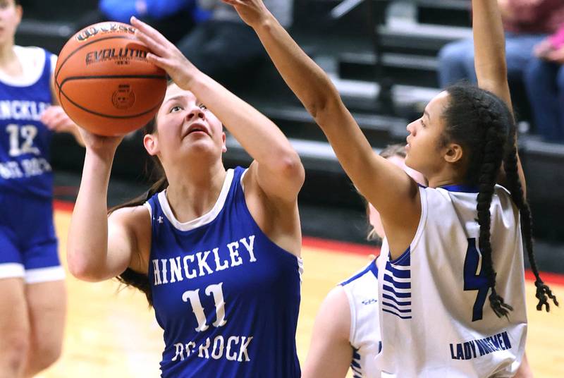 Hinckley-Big Rock's Raven Wagner shoots over Newark’s Kiara Wesseh Thursday, Jan. 18, 2024, during the Little 10 girls basketball tournament at Indian Creek High School in Shabbona.