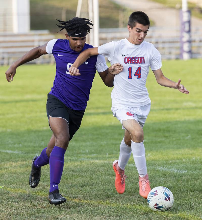 Dixon’s Quintynn Server (left) and Oregon’s Chase Buchanan fight after a ball Wednesday, Sept. 11, 2024, at EC Bowers field in Dixon.