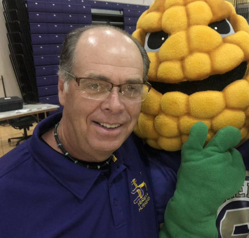 Serena High School athletic director Dean DeRango, pictured here hanging with Huskers mascot Bob the Cob, will be retiring from the position after 20 years on June 3.