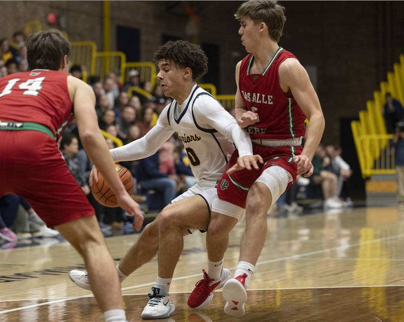 Sterling’s Andre Klaver handles the ball against LaSalle-Peru’s Seth Adams Friday, Feb. 23, 2024 during a class 3A regional final at Sterling High School.