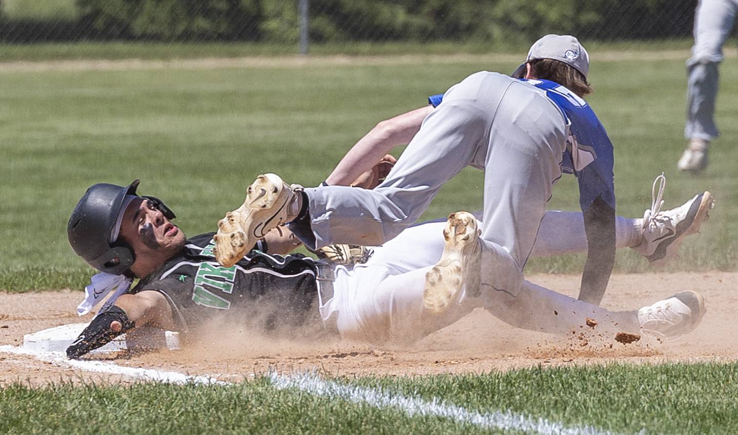 Newman’s Liam Nicklaus tags out North Boone’s RJ Wolski at third base Saturday, May 25, 2024 at the Byron 2A sectional final.