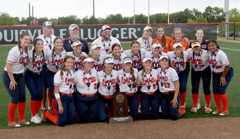 Members of the Oswego softball team pose with the  Class 4A third place trophy on Saturday, June 8, 2024 at the Louisville Slugger Sports Complex in Peoria.