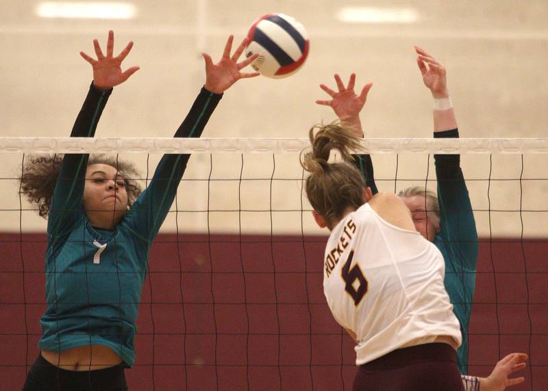 Woodstock North’s Chloe Soto-Garcia, left, blocks in varsity volleyball on Monday, Sept. 16, 2024, at Richmond-Burton High School in Richmond.