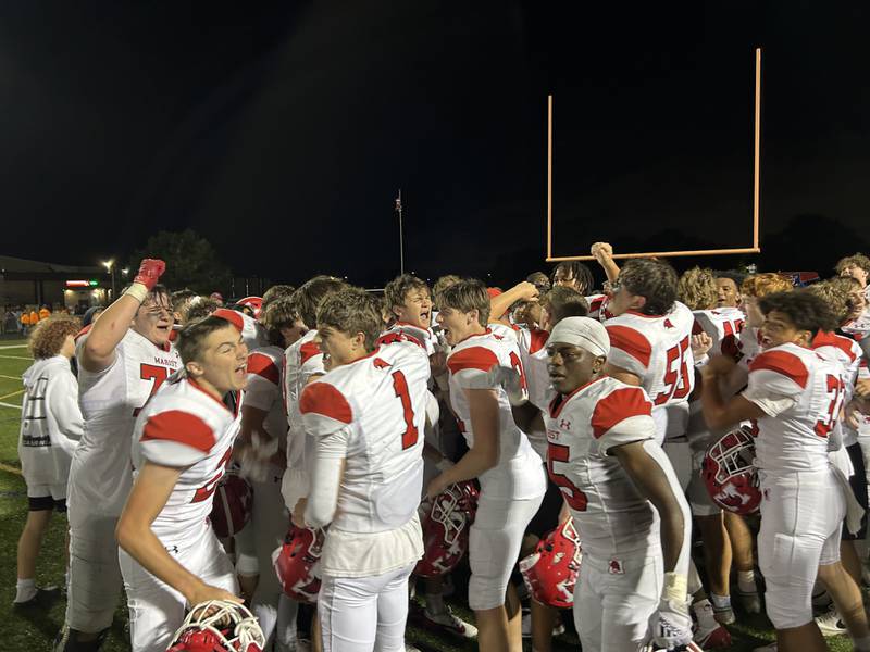 Marist players celebrate after their 34-27 overtime win over Brother Rice on Friday in Chicago.