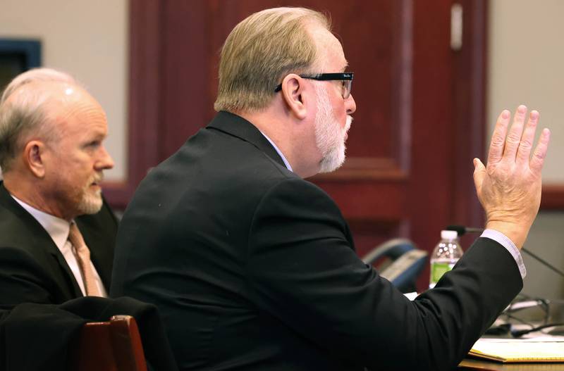 Douglas Moeller, (right) former DeKalb School District 428 superintendent, asks a question of Circuit Court Judge Philip Montgomery after his sentencing Tuesday, Jan. 1, 2023, at the DeKalb County Courthouse in Sycamore. Moeller was sentenced to community service after being found guilty of one count of non-consensual dissemination of a private sexual image, a class 4 felony.