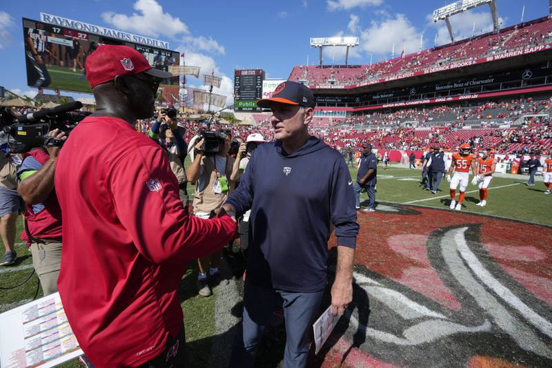 Tampa Bay Buccaneers head coach Todd Bowles (left) shakes hands with Chicago Bears head coach Matt Eberflus at the end of an NFL game, Sunday, Sept. 17, 2023, in Tampa, Fla.