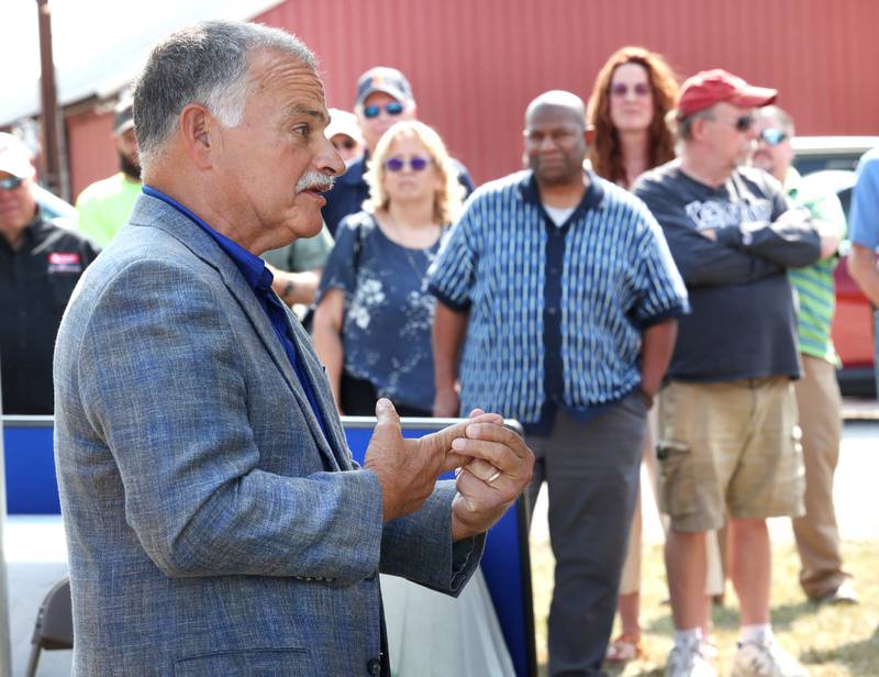 Veteran farm broadcaster Max Armstrong speaks Tuesday, Sept. 10, 2024, during the dedication, hosted by the DeKalb Area Agricultural Heritage Association, for the new historical marker at the farm of Steve Faivre in DeKalb. The marker celebrates the creation yield monitor, an important innovation in farming.