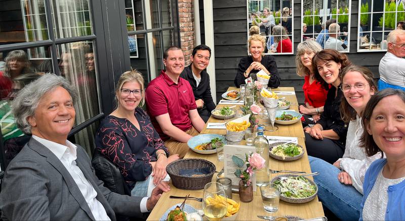 Illinois Valley Community College's Director of Admissions, Tom Quigley, recently visited Holland (The Netherlands) as part of a professional exchange program. He reunited with teacher Ryan Smulders, who had been his guest last fall. and sampled Dutch life and work. Quigley (in the red shirt) is seated left with Smulders behind him as they dined with college faculty and administrators.