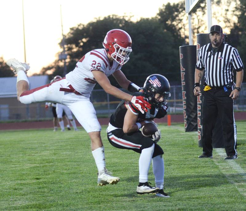 Erie-Prophetstown's Max Milem (4) protects the ball from Hall's Jack Jablonski (22) during a two-point conversion on Friday, Sept. 6, 2024  in Prophetstown.