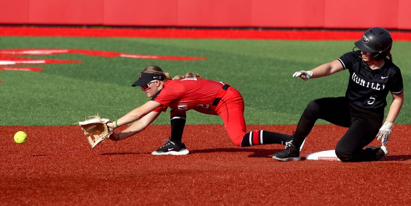 Huntley’s Christina Smith, right, is safe at second base as  Barrington’s Shaylee Hiser fields a toss for an attempted force out in sectional final softball  action at Barrington Friday.