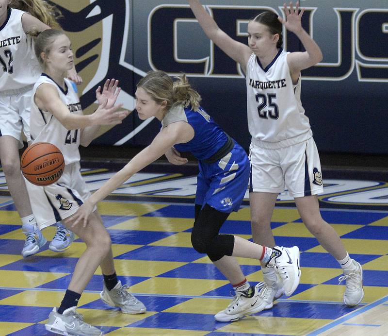 Marquette’s Avery Durdan knocks the ball away from Princeton’s Erin May during the 1st in Bader Gymnasium on Saturday, Jan. 7, 2023 at Marquette High School.