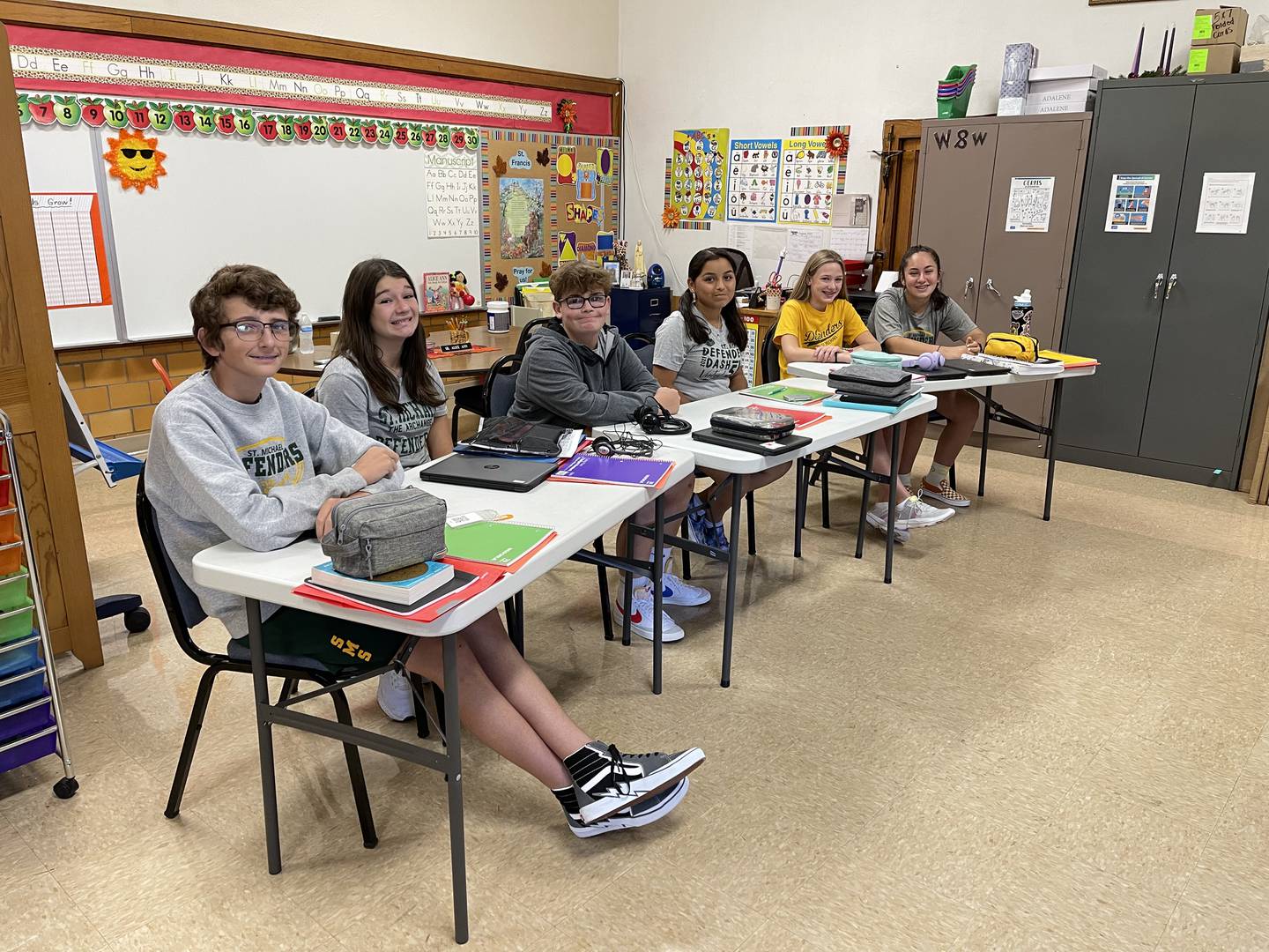 Six St. Michael eighth graders are taking algebra and Spanish I by interacting with Streator High School courses through video technology.