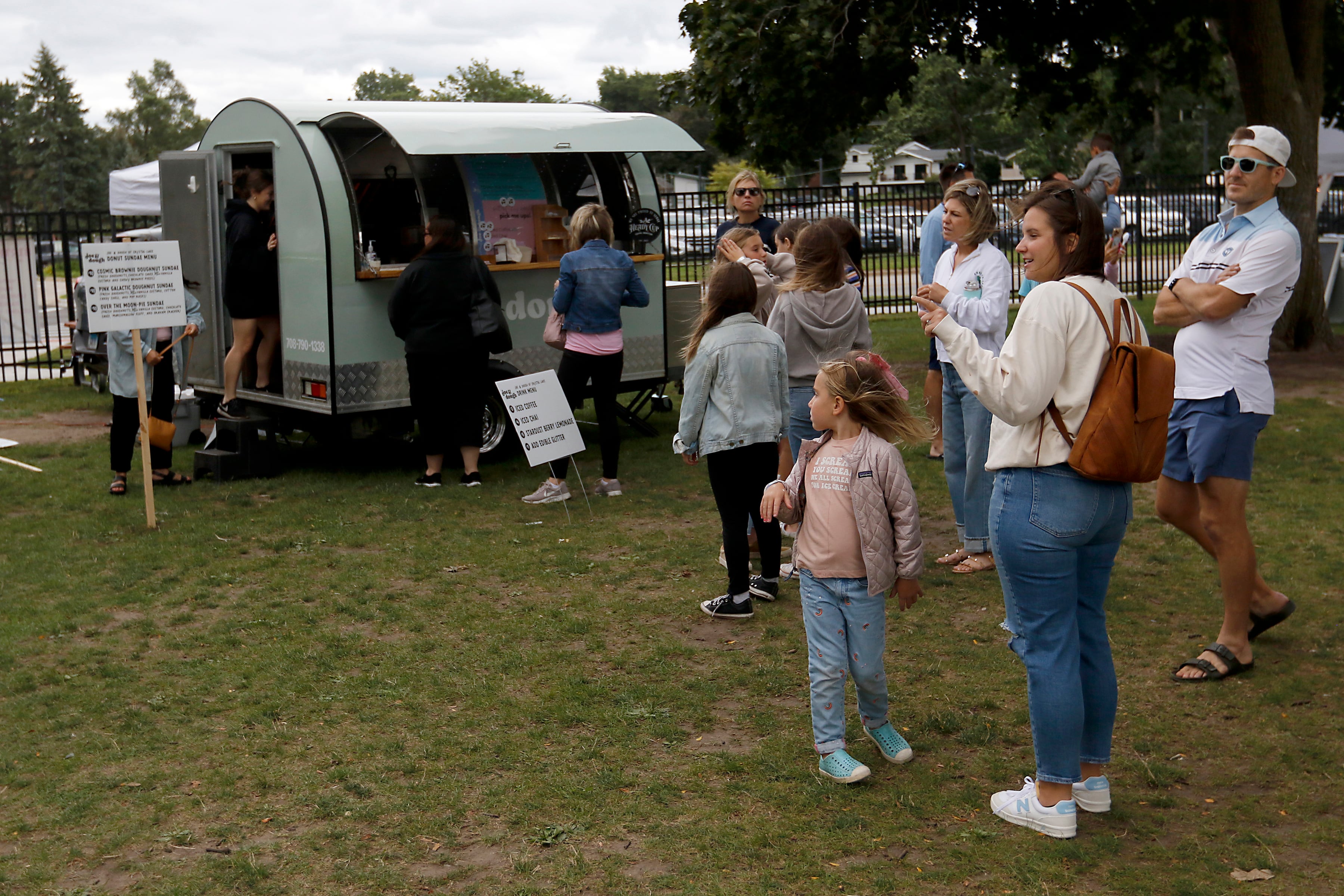 People wait in line to get sundaes from Joe & Dough during the Ice Cream Fest on Friday, Aug. 9, 2024, at Crystal Lake’s Main Beach.  The second annual event featured music, ice cream venders and an ice cream eating contest.