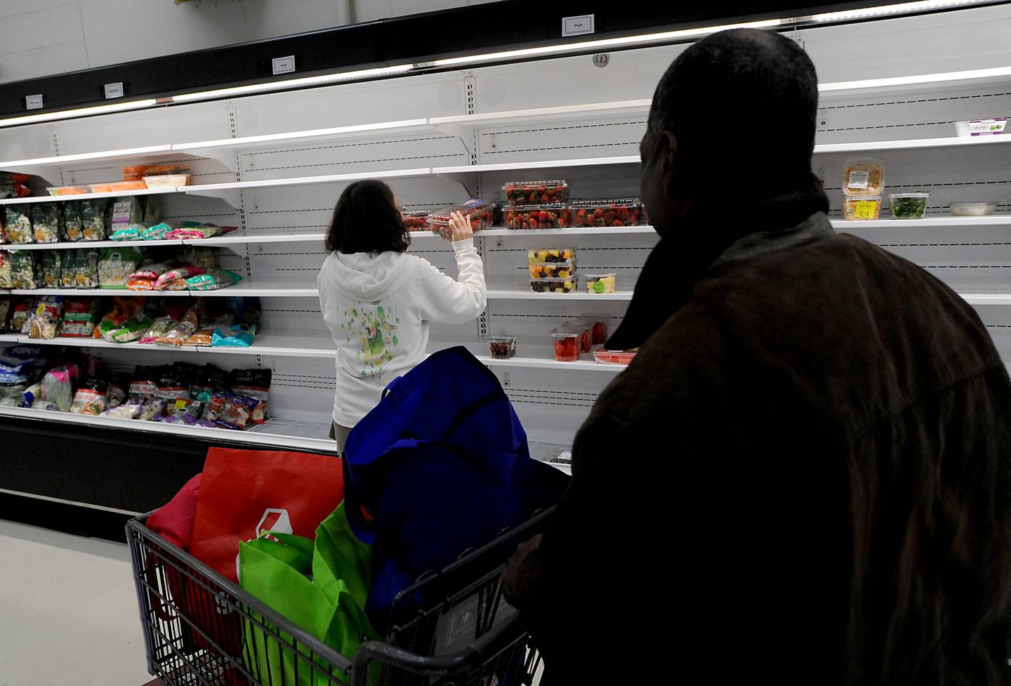 People shop for food Monday, April 25, 2022, at the Crystal Lake Food Pantry, 42 East Street, in Crystal Lake. Food pantries across McHenry County are combating both inflation and increasing need.