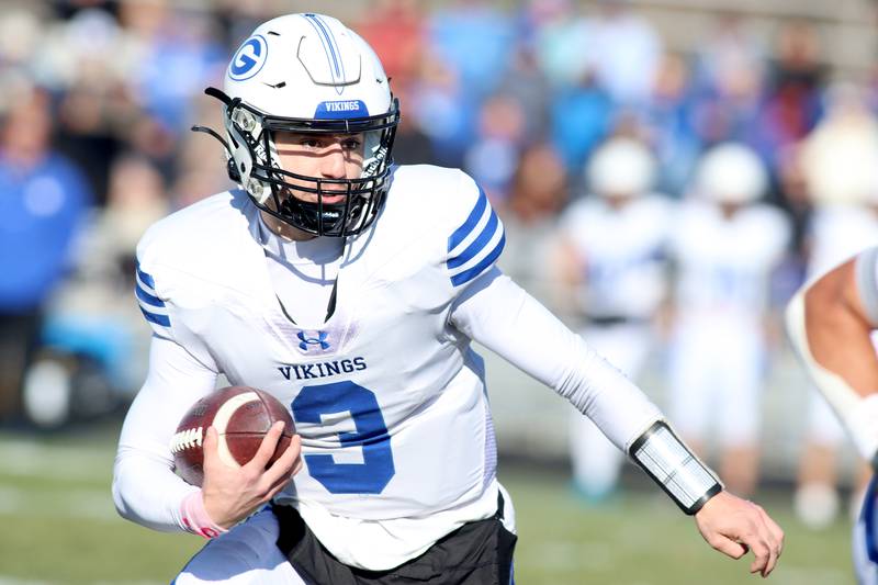 Geneva’s Nate Stempowski looks for running room in IHSA Class 6A quarterfinal playoff football action at Cary Saturday.