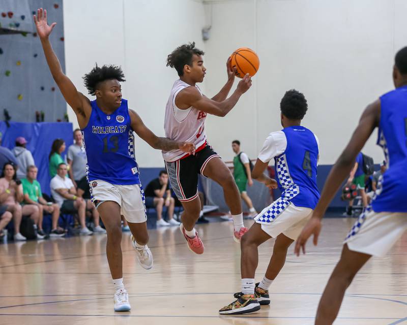 Benet's Blake Fagbemi (0) makes a pass from the top of the key at the Riverside-Brookfield Summer Shootout basketball tournament. June 22, 2024.