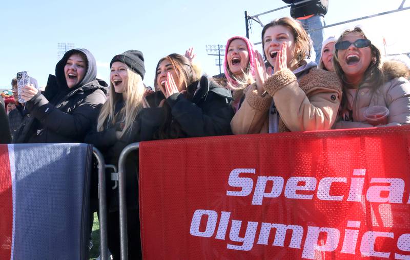 The crowd cheers on the plungers on a cold and windy Saturday, Feb 17, 2024, during the Huskie Stadium Polar Plunge at Northern Illinois University in DeKalb. The Polar Plunge is the signature fundraiser for Special Olympics Illinois.