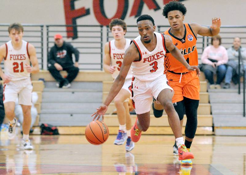 Yorkville's Dayvion Johnson (3) takes a breakaway for a score in front of Romeoville defender Mickeis Johnson (1) during a varsity basketball game at Yorkville High School on Friday, Jan. 19, 2024.