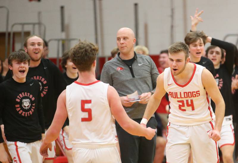 Streator's Landon Muntz reacts with teammate Isaiah Weibel after sinking a three-point basket against Pontiac during the Class 3A Regional semifinal game on Wednesday, Feb. 22, 2024 at Pops Dale Gymnasium.