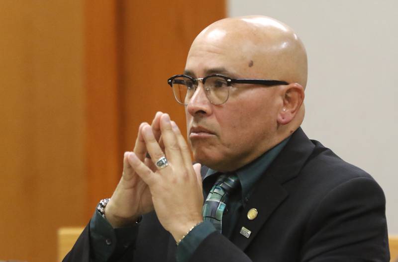 Former Illinois Department of Children and Family Services employee Carlos Acosta listens as McHenry County prosecutors give closing arguments at his trial In October after he was charged with mishandling the case of AJ Freund in Crystal Lake before the boy was killed by his mother. Acosta was convicted and is due to be sentenced Thursday, June 6, 2024.