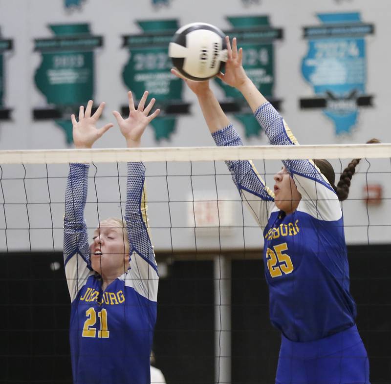 Johnsburg's Carlie Majercik and Juliana Cashmore try to block the ball  during a Kishwaukee River Conference volleyball match against Woodstock North on Wednesday, Sept. 4, 2024, at Woodstock North High School.