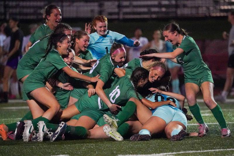 York players celebrate after defeating Downers Grove North in penalty kicks during a Class 3A Hinsdale Central Sectional semifinal soccer match at Hinsdale Central High School in Hinsdale on Tuesday, May 21, 2024.