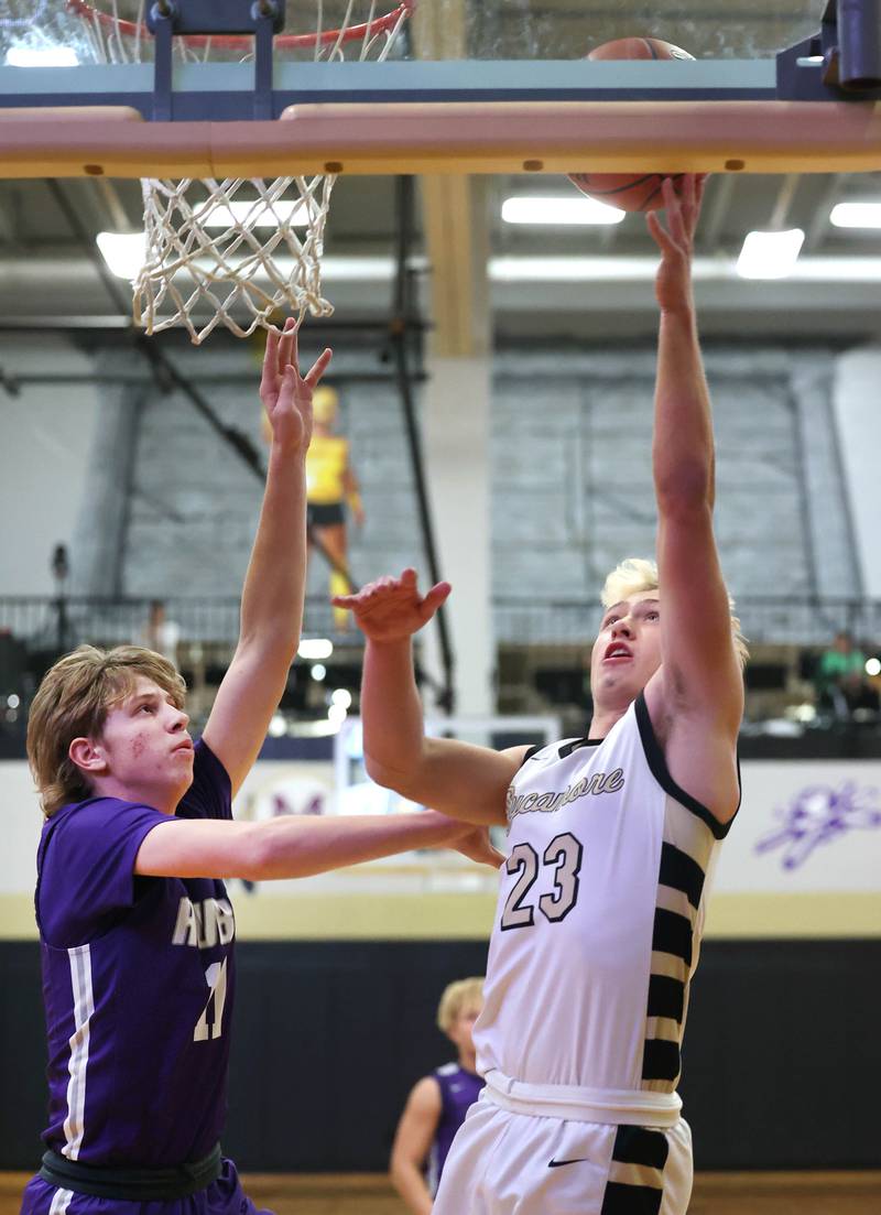 Sycamore's Carter York goes to the basket against Rochelle's Brody Bruns during their game Tuesday, Dec. 5, 2023, at Sycamore High School.