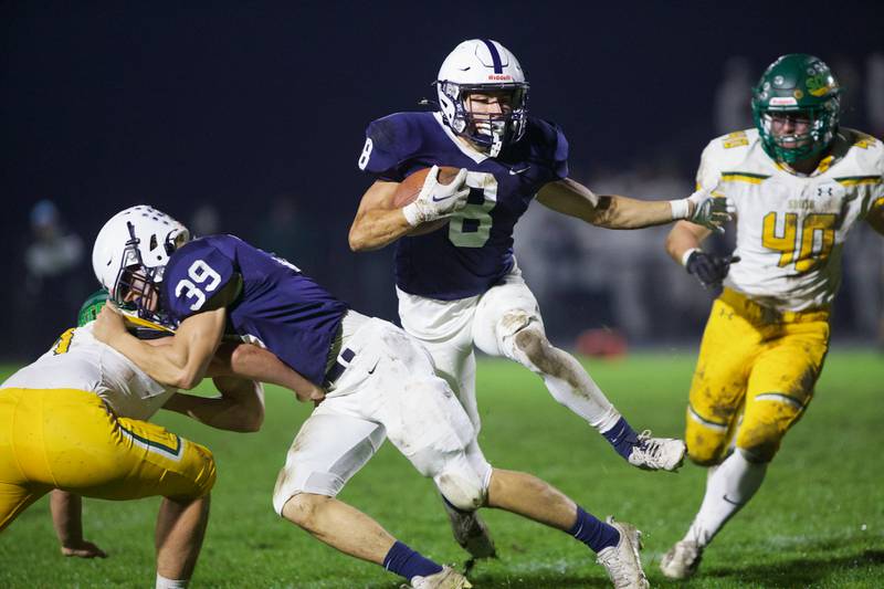 Gary - Grove's Andrew Prio runs for a gain against Crystal Lake South on Friday, Oct. 13 2023 in Cary Grove.