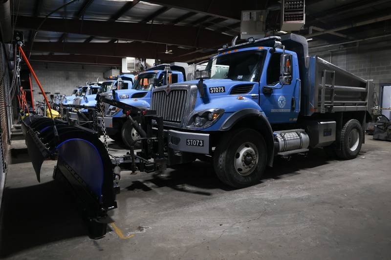 Salt trucks are loaded with salt in preparation for the expected snow fall Monday evening at one of City of Joliet Roadways Division facilities on Monday, Jan. 8, 2024 in Joliet.